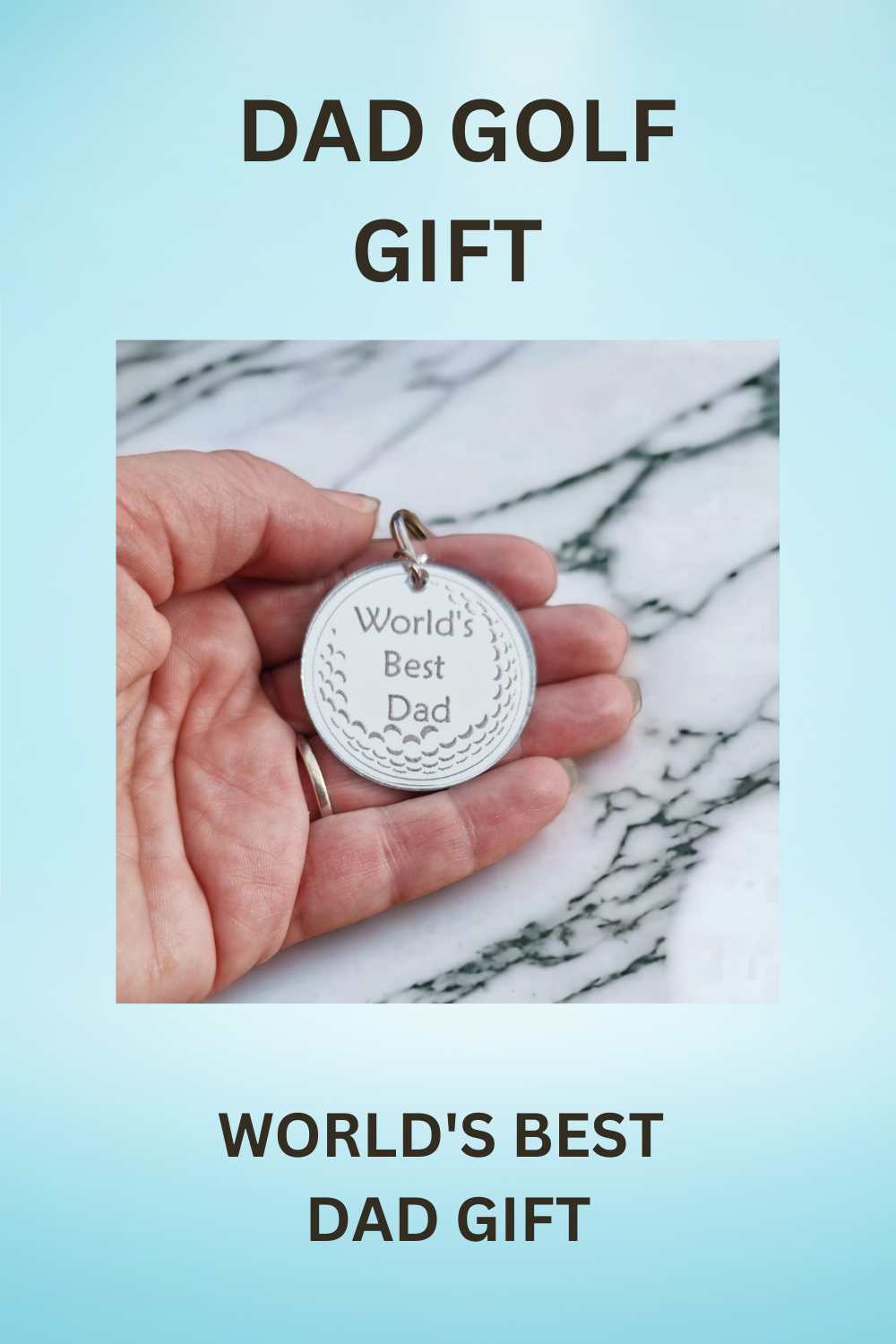 Blue background With the text "DAD GOLF GIFT" at the top and "WORLD'S BEST DAD GIFT" at the bottom with the image of the keyring being held in the centre. This image is suitable for pinning to Pinterest.