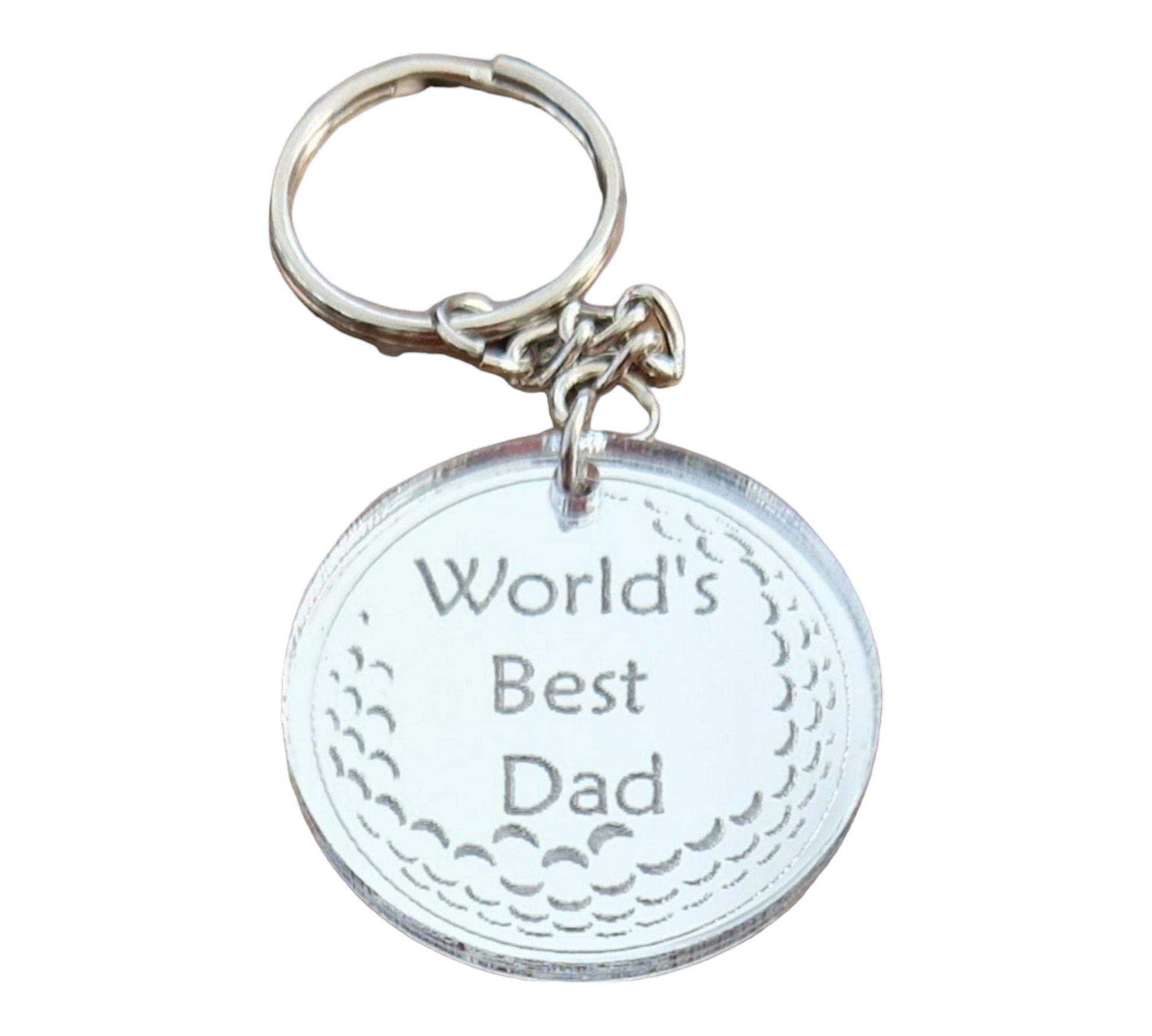 Mirror silver circle with the partial image of a golf ball and the text "World's Best Dad" laser engraved into it. The circle is attached to a metal keychain.