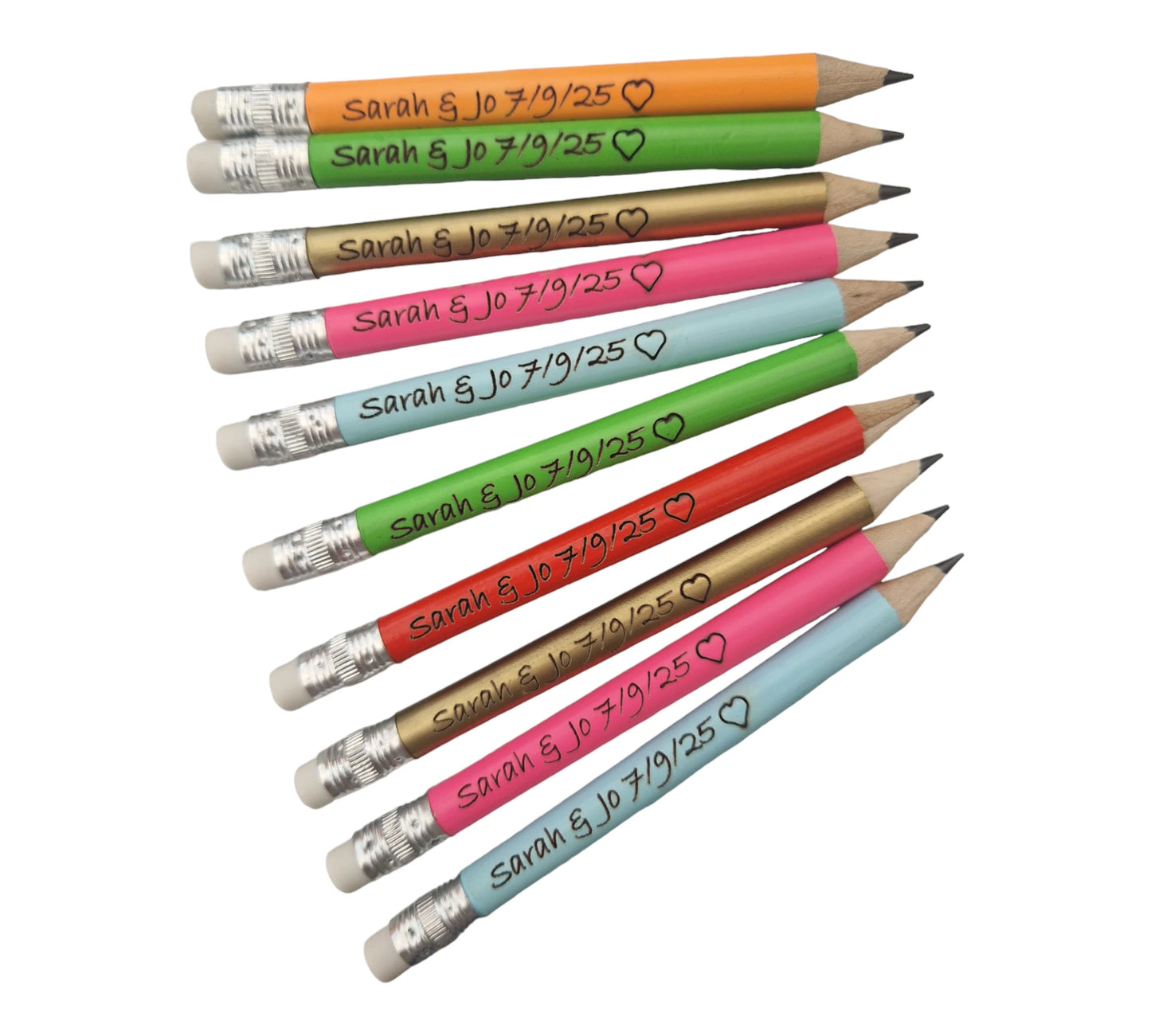 neon orange, neon green, gold, neon pink, light blue and red pencils with the text "Sarah & Jo 7/9/25" and the outline of a heart laser engraved into them