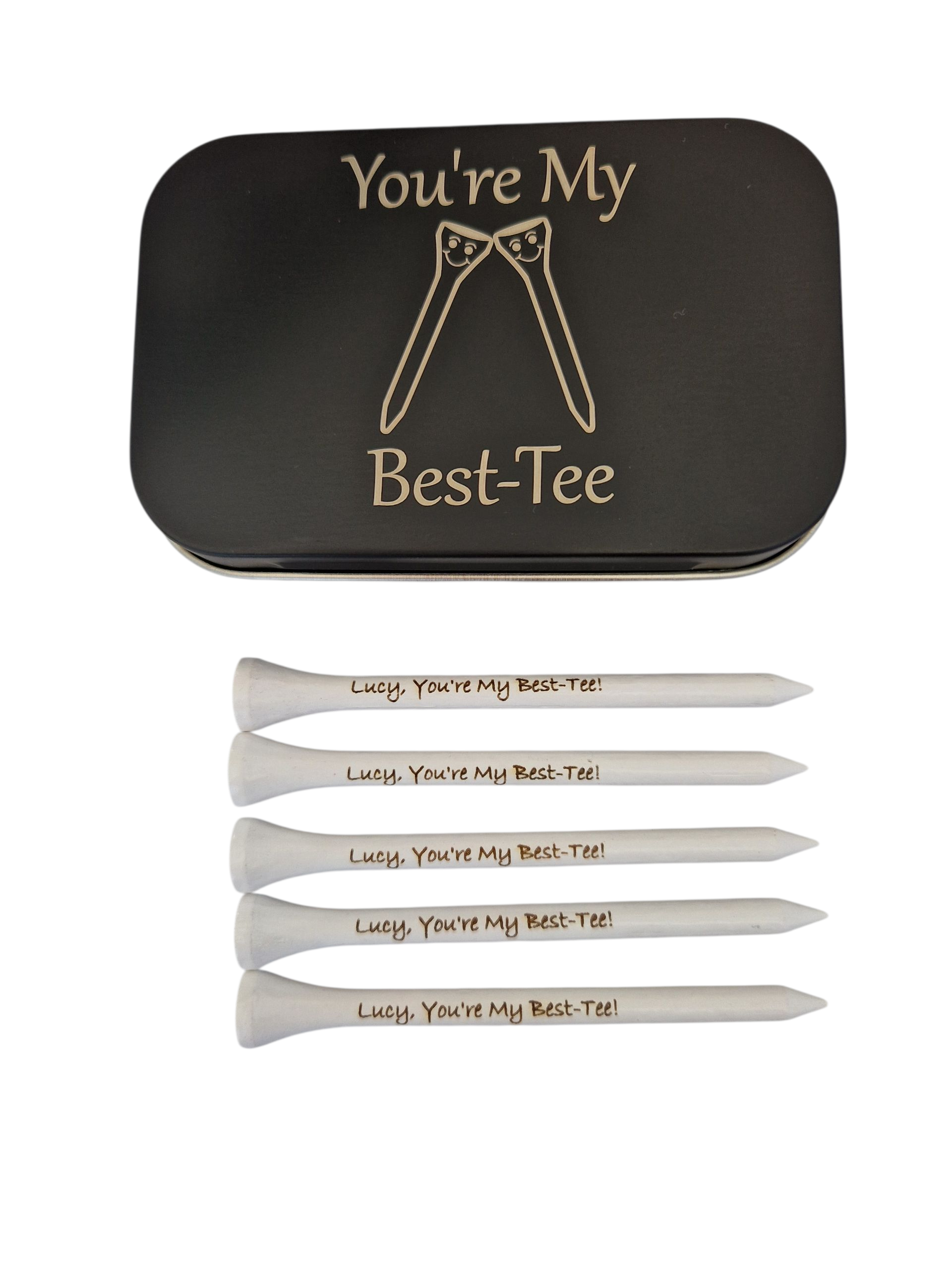 Black metal tin with the text "You're My Best-Tee" and the image of 2 golf tees touching heads. There are smiling faces on the golf tees.
Plus 5 white golf tees with the text "Lucy, You're My Best-Tee!" laser engraved into them