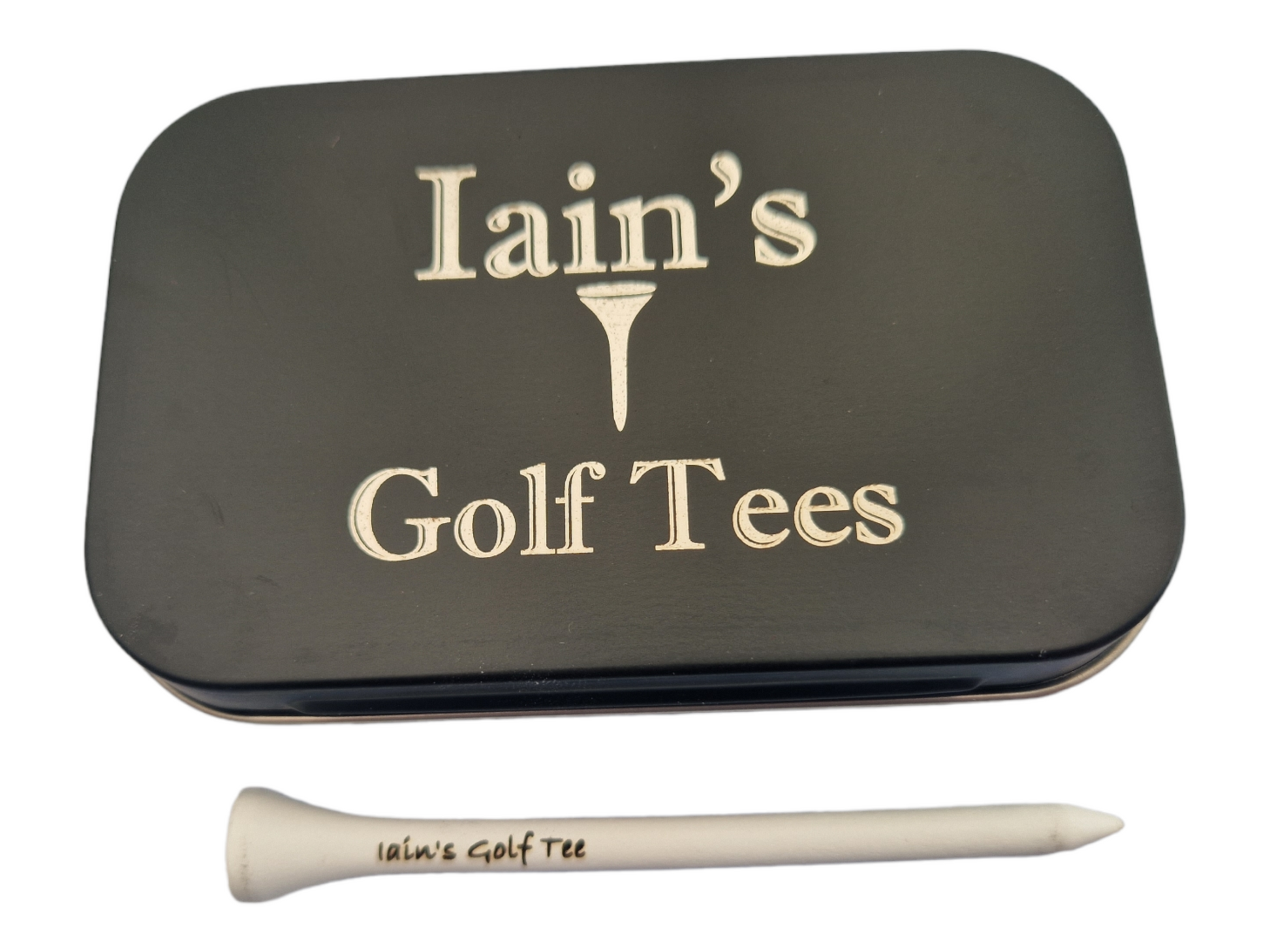 A black tin with the text "Iain's Golf Tees" and the image of a golf tee laser engraved into it. An 83mm tee with "Iain's Golf Tee" laser engraved into it.