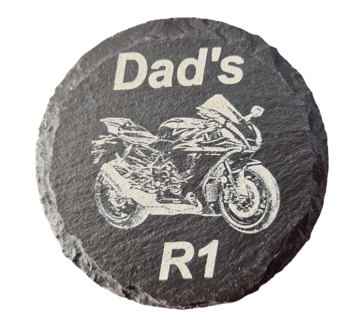 Round slate coaster with the text "Dad's" at the top  of the coaster and "R1" at the bottom of the coaster. With the image of a Yamaha R1 laser engraved into the centre of the coaster.