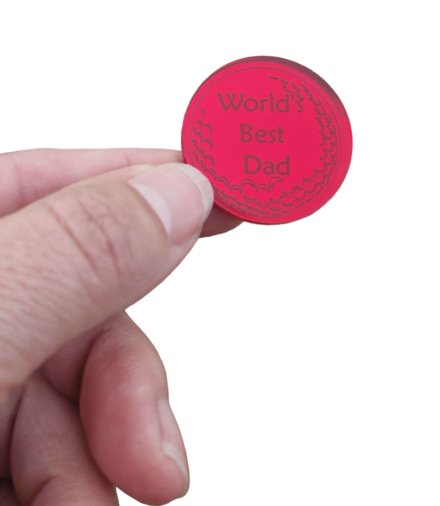 Mirror red ball marker with the text "World's Best Dad". Around the text are the dimples of a golf ball. The ball marker is being held