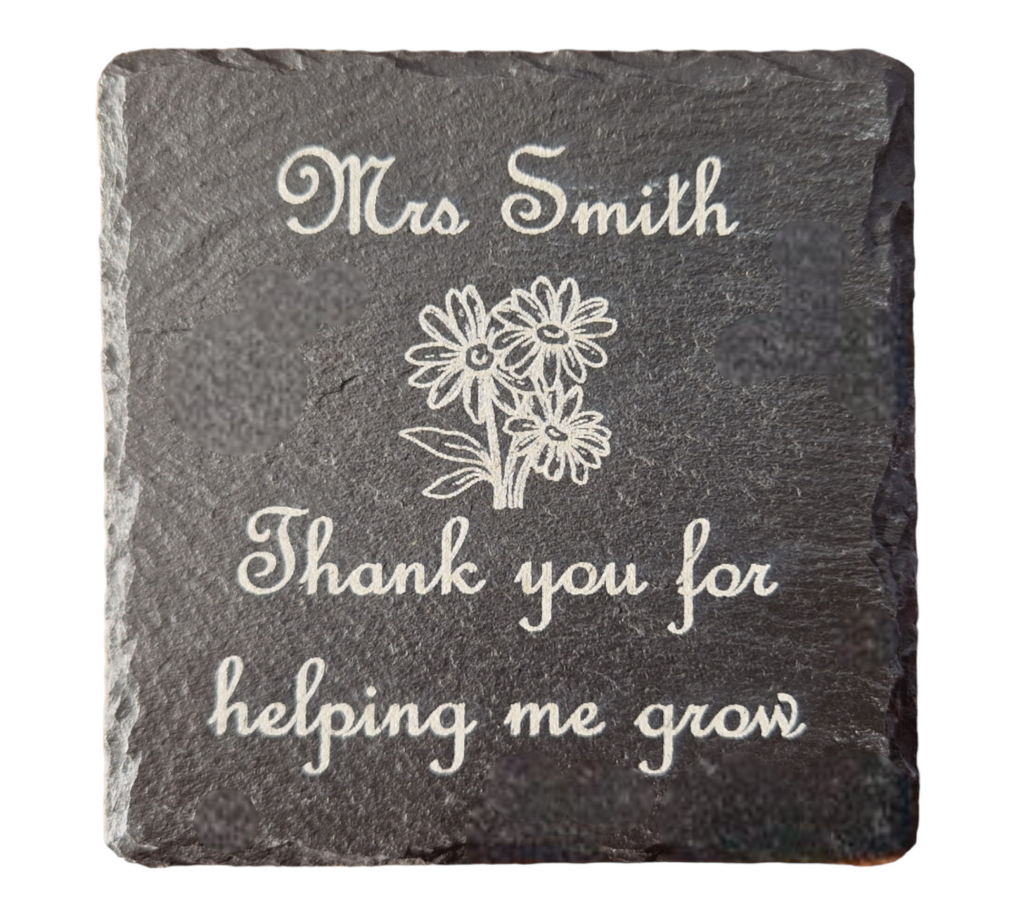 Slate coaster with the text "Mrs Smith Thank you for helping me grow" and the image of some flowers in the centre of the coaster.