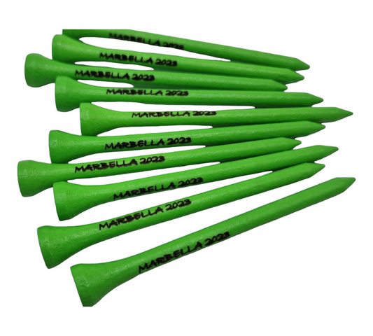 Green 83mm golf tees laser engraved with the text "MARBELLA 2023"