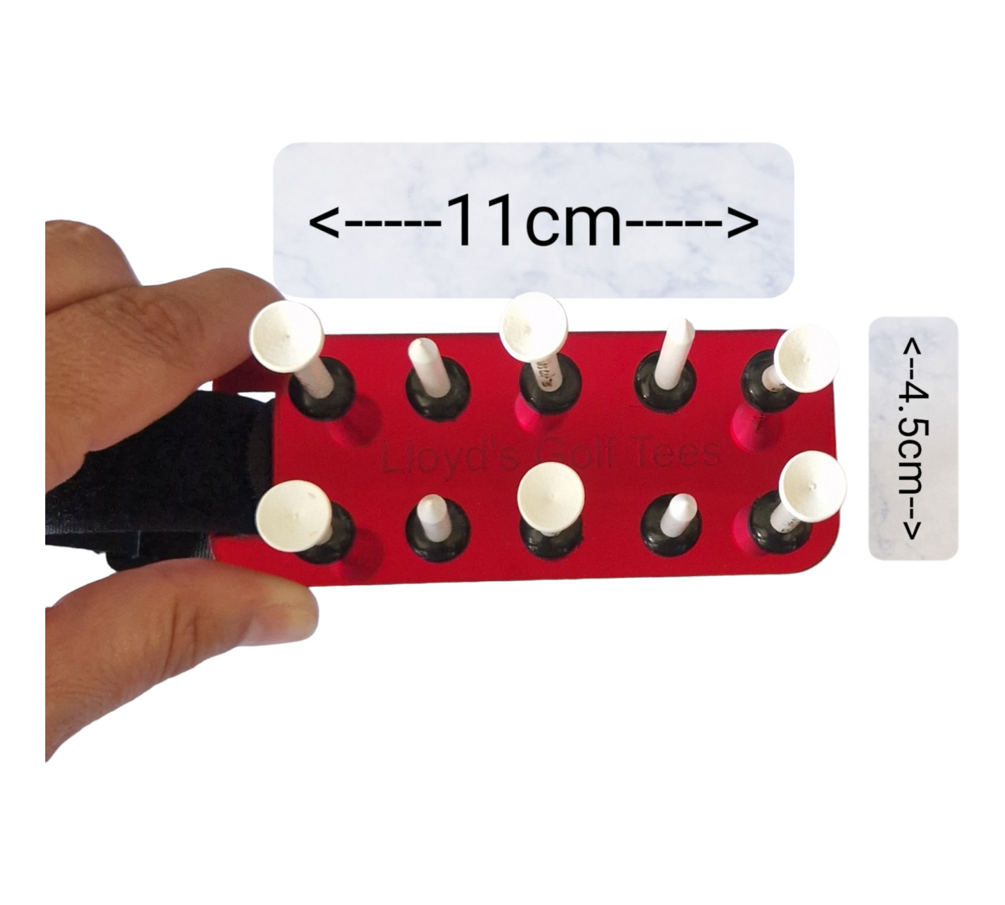 Image showing a different angle of the red golf tee holder. The holder is being held, the tees are placed inside the holder. The image also shows the dimensions of the holder excluding the strap (11x4.5cm) 