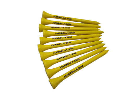 Yellow golf tees laser engraved with the text "MARBELLA 2023"